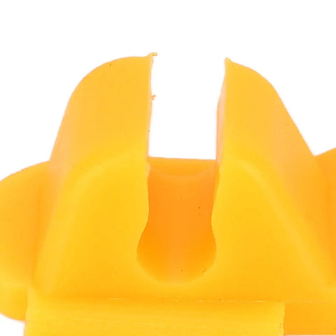 Close-up of yellow Six Pack Tire Changer Rim Protector, universal fit, durable plastic insert for scratch-free wheel rim care during mounting.