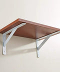 White Heavy Duty L Shaped Shelf Bracket Rock Solid Wall Mount supporting a wooden shelf against a wall.