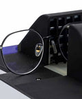 Quick Fix Optical Frame Heater For Resin And Plastic Eyeglasses adjusting black frame with lens in heater slot.