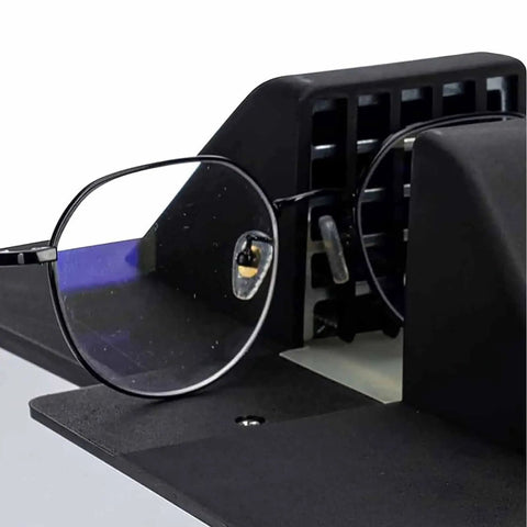 Quick Fix Optical Frame Heater For Resin And Plastic Eyeglasses adjusting black frame with lens in heater slot.