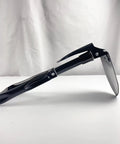 Side view of Tri Fold Survival Shovel With Pick Carbon Steel Tactical Entrenching Tool for outdoor tasks, folded position, black.