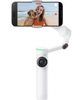 Flow 2 Pro Smartphone Gimbal With 3 Axis Stabilization And AI Tracking, white finish, holding a phone recording a beach video
