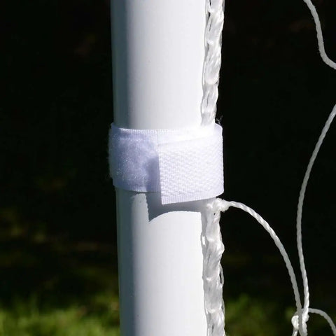 Close-up of Easy Set Soccer Goal 6 Foot By 4 Foot Portable Backyard Frame with self-stick net strap on rust-resistant steel pole