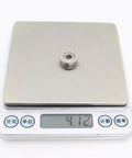 Premium 10 Pack Stainless Steel SF605ZZ Flanged Deep Groove Ball Bearings 5x14x5mm on digital scale showing weight.