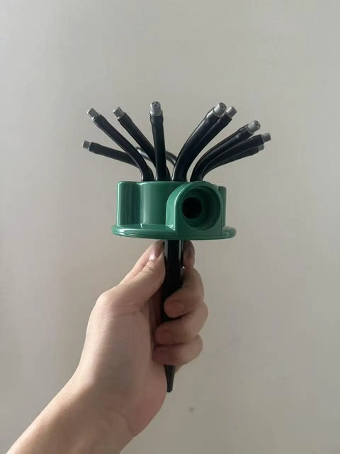 Hand holding Two Pack 360 Degree Garden Automatic Multi Sprinkler System For Lawn And Yard Watering Stake Mounted With 12 Adjustable Nozzles