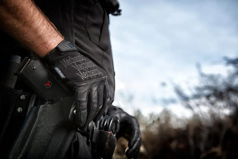 Heavy Duty Tactical Recon Gloves With Slim Fit Leather For Maximum Dexterity Touchscreen Compatible And Machine Washable Large Covert Black on person holding gear