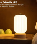 Cozy Small Table Lamp For Bedroom And Nightstand, Kid Friendly Minimalist Solid Wood Lamp glowing on nightstand
