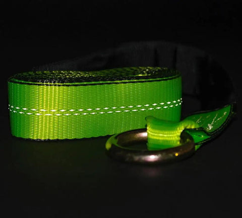 Close-up of a high viz green 4 Pack 2 Inch By 8 Foot Car Tie Down Ratchet Strap with chain anchor, 3335 LBS WLL, against dark background.