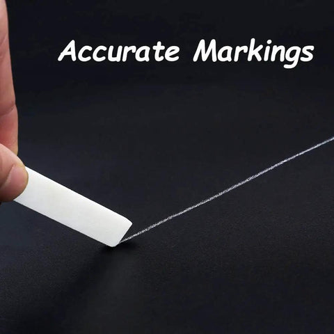 Hand using Soapstone Pencils 27 Pack for Welding and Textile Marking on a black surface, showing accurate white markings
