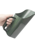 Hand holding Multifunctional Garden Scoop Shovel For Potting And Transplanting Lightweight Plastic Digging Tool in army green