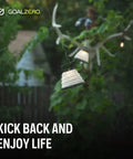 Crush Light Solar Powered Camping Lantern With Collapsible Design hanging outdoors on a string light for outdoor adventures.
