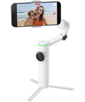 Flow 2 Pro Smartphone Gimbal With 3 Axis Stabilization And AI Tracking showing smartphone on beach setting, white tripod view