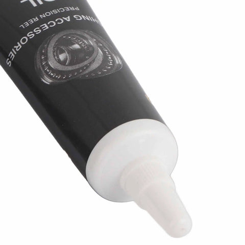 Fishing Reel Lubrication Kit with Pro Grade Maintenance Oil, close-up of black tube with nozzle for spinning reels.