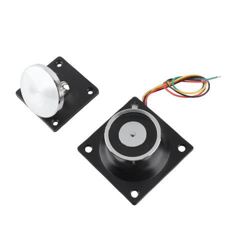 Heavy Duty Electromagnetic Door Stopper Holds Up To 60kg Solid As A Rock With Instant Safe Release For Wood And Metal Doors Running On 12V To 24V DC Dual Voltage Security Gear shown from above with black base and wiring.