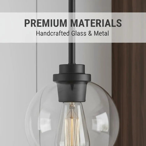 Close-up of Straight Up Matte Black Globe Pendant Lights 2 Pack With Clear Glass Shades showcasing handcrafted materials.