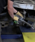 Person using 36V MultiVolt Half Inch Mid Torque Cordless Impact Wrench Workhorse Tool Only No Battery Four Speed Settings on car
