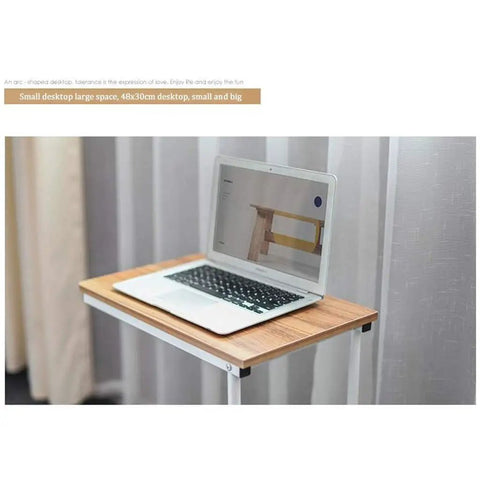 No Stress Rolling Laptop Desk And Mobile Workstation Stand Adjustable Tilt Table with a laptop on a wood surface.