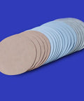 20 Pcs Premium Self Adhesive Sanding Discs With Flocking Back displayed in a stack, showing various grit levels for automotive polishing.
