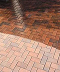 Before and after treatment of paved slabs showing the effect of Heavy Duty 25 Percent High Solids Styrene Acrylic Concrete Sealer Brings Out Natural Color And Kills Whitening On Brick And Paved Slabs Real Deal 5 Gallon Can Protection.