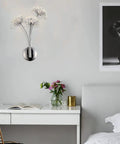 Crystal Glass 3 Light Dandelion Wall Sconce In Brushed Nickel Stainless Steel Mount for bedroom with desk and artwork.