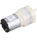 Rock Solid Mini Micro Air Vacuum Pump Running Next Level Quiet With Low Voltage Safety Design Knockout High Performance And Compact Durability motor close-up with plastic shell and connectors.