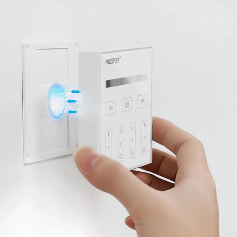 Hand holding Four Zone Wireless Panel Remote Battery Powered No Wiring Setup With Magnetic Holder Outdoor Mount No Fuss Easy 2 4G RF Control Brightness Adjustable For FUT035W Plus MiLight Series