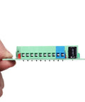 Hand holding 8 Channel Voltage Level Converter Module From 24V To 3V3 For MCU And PLC PNP NPN Signal Translator Fast 20KHz PCB