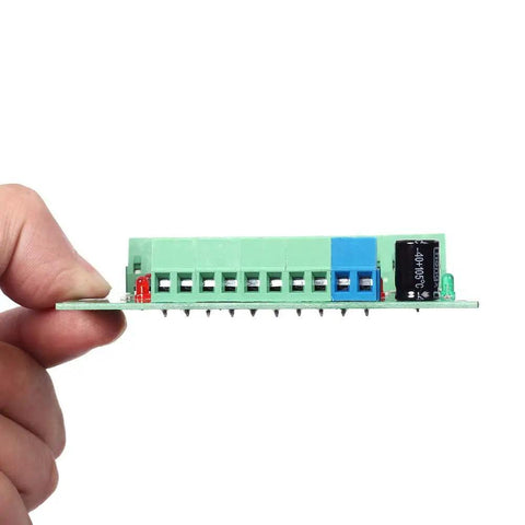Hand holding 8 Channel Voltage Level Converter Module From 24V To 3V3 For MCU And PLC PNP NPN Signal Translator Fast 20KHz PCB