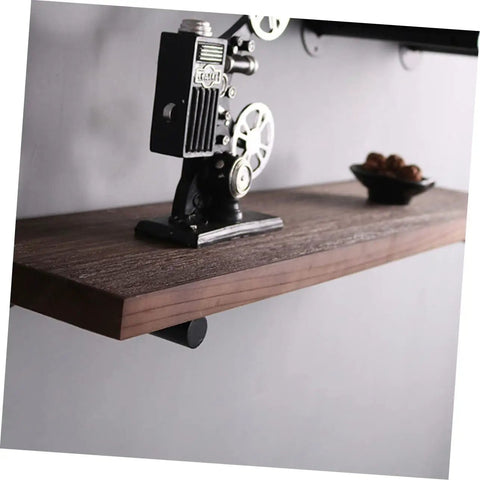 Rock Solid Heavy Duty Wall Mounted Shelf Brackets Four Pack Black Iron Pipe Style, holding vintage decor on wood shelf.