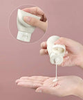 Person squeezing Grab And Go Leak Proof Travel Bottle Set Of 3 60 Ml Refillable Squeezable Containers for toiletries