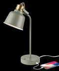 Lofty Industrial 18 Inch Desk Lamp With 2.1 USB Port In Matte Sage Green And Brass Accents next to charging phone