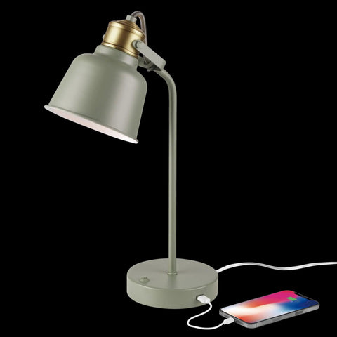 Lofty Industrial 18 Inch Desk Lamp With 2.1 USB Port In Matte Sage Green And Brass Accents next to charging phone