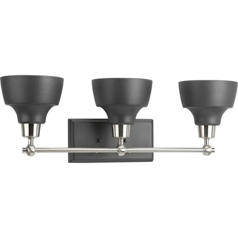 Bramlett Bath And Vanity Light In Nickel Finish with vintage industrial style, featuring three black shades on a brushed nickel bar.