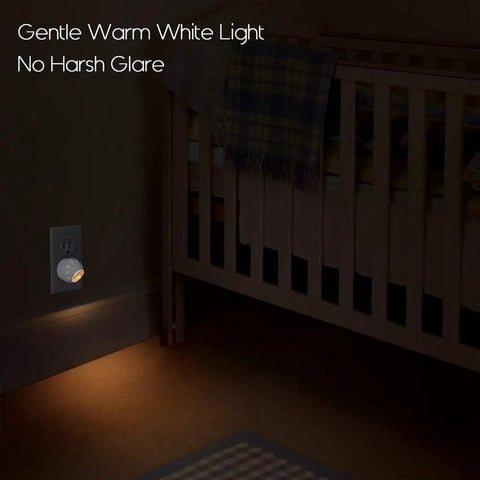 Plug In Night Light With Dusk To Dawn Sensor, 360 Degree Rotation in nursery, warm white glow illuminating crib area