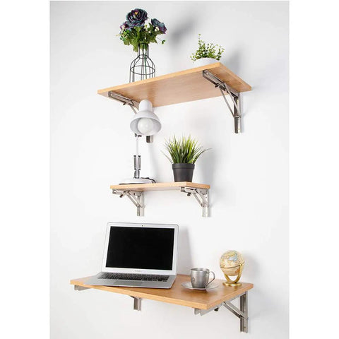 Premium 304 Stainless Steel Folding Shelf Brackets Triangle Wall Mounts supporting wooden shelves with plants and lamp.