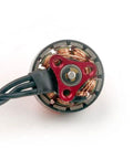 Close-up of EX1103 11000KV Brushless Drone Motor for Mobula 8 with 1.5mm shaft, showing Unibell design and copper windings