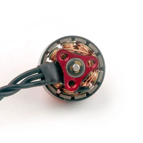 Close-up of EX1103 11000KV Brushless Drone Motor for Mobula 8 with 1.5mm shaft, showing Unibell design and copper windings