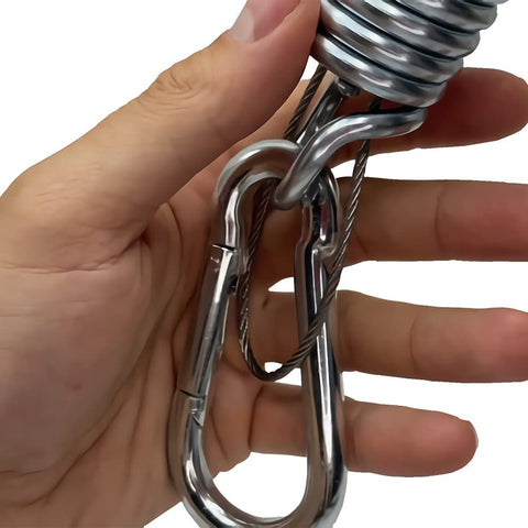 Person holding Beefy Heavy Duty Swing Springs Kit with 2 700 lb capacity springs and snap hooks for porch and hammock use.