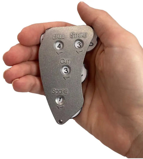 Aluminum Umpire Indicator With Four Dials For Baseball Scorekeeping And Calls, featuring thumb indents in a hand view.