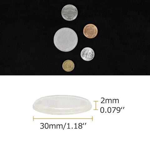 Slick Silicone Adhesive Furniture Pads For Glass Tables And Cabinet Drawers Featuring Dead Quiet Anti Slip Grip showing size with coins for scale.