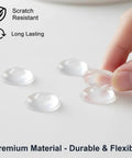 164 Pc Clear Silicone Cabinet Bumper Pads Self Adhesive Drawer Protectors Noise Reducing Stickers being placed by a hand.