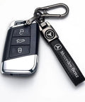 Mercedes Benz Tire Valve Caps And Leather Keychain Set, close-up of iron keyring with leather keychain attached to car remote.