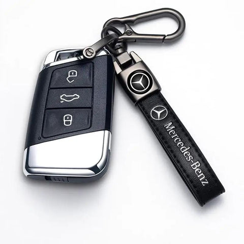 Mercedes Benz Tire Valve Caps And Leather Keychain Set, close-up of iron keyring with leather keychain attached to car remote.