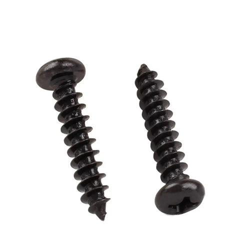 Rust Resistant Round Head Self Tapping Screws With Phillips Cross Drive High Strength Carbon Steel Miniature Fasteners For Electronics And Badass DIY Repairs Straight Up Built Like A Tank For Long Lasting Use, showing oxidized black heads.