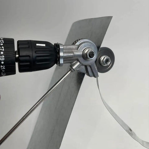 Upgrade Your Shop With This Electric Drill Shears Attachment mounted on a drill, cutting through a sheet of metal.