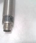 Close-up of Inductive Proximity Sensor Ig0345 For Industrial Automation with metal threads, durable housing, used good condition