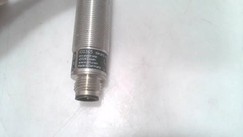Close-up of Inductive Proximity Sensor Ig0345 For Industrial Automation with metal threads, durable housing, used good condition