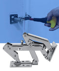 Pair of stainless steel frameless cabinet hinges with soft-close dampers, being installed with screwdriver