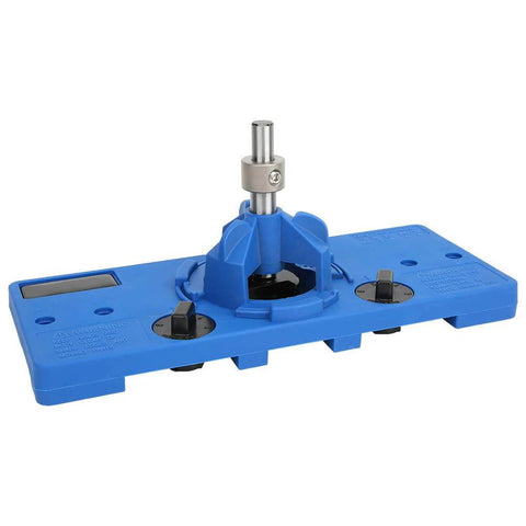 Front view of blue plastic cabinet hinge drilling guide jig with central metal guide post.