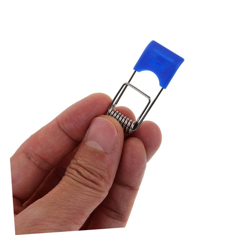 Hand holding a 50 Pcs Recessed Light Clips Spring Clips For Downlight Installation with blue plastic grip and metal spring.